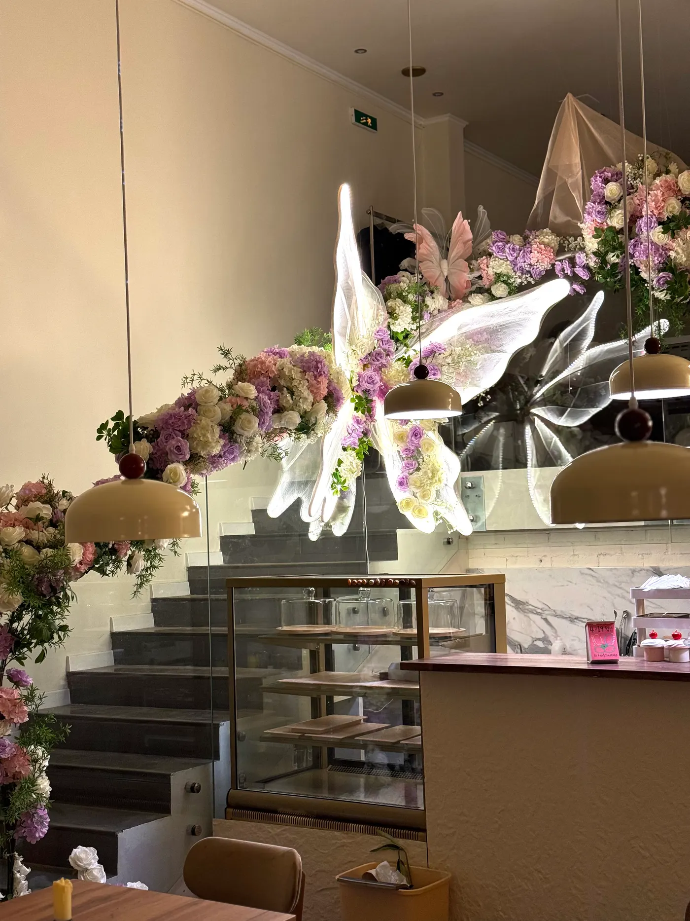 Zorya cafe interior with a flower and butterfly installation